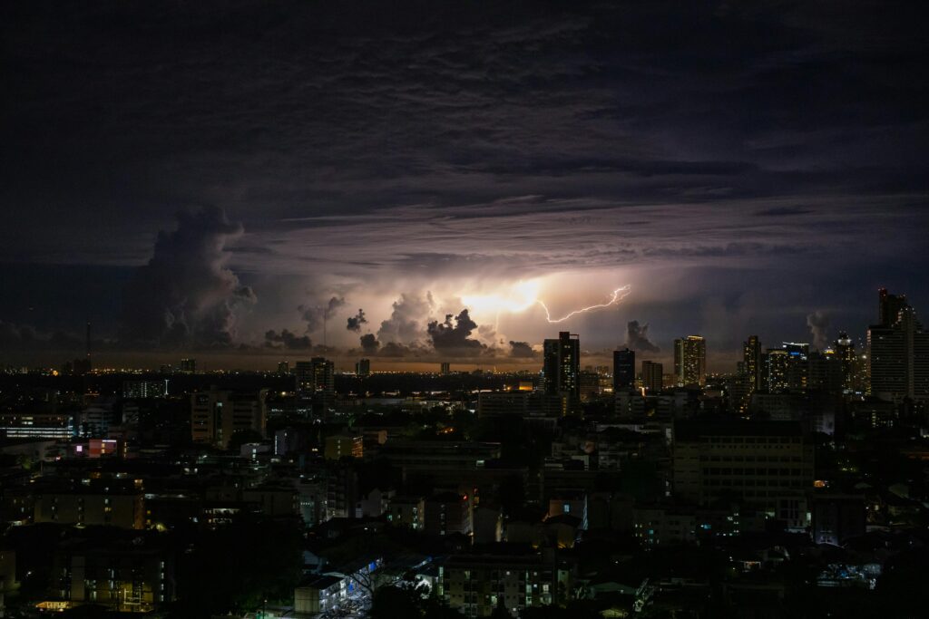 Wild thunderstorms light up the Bangkok skyline - one of the many things to expect while traveling to Thailand during the wet season.